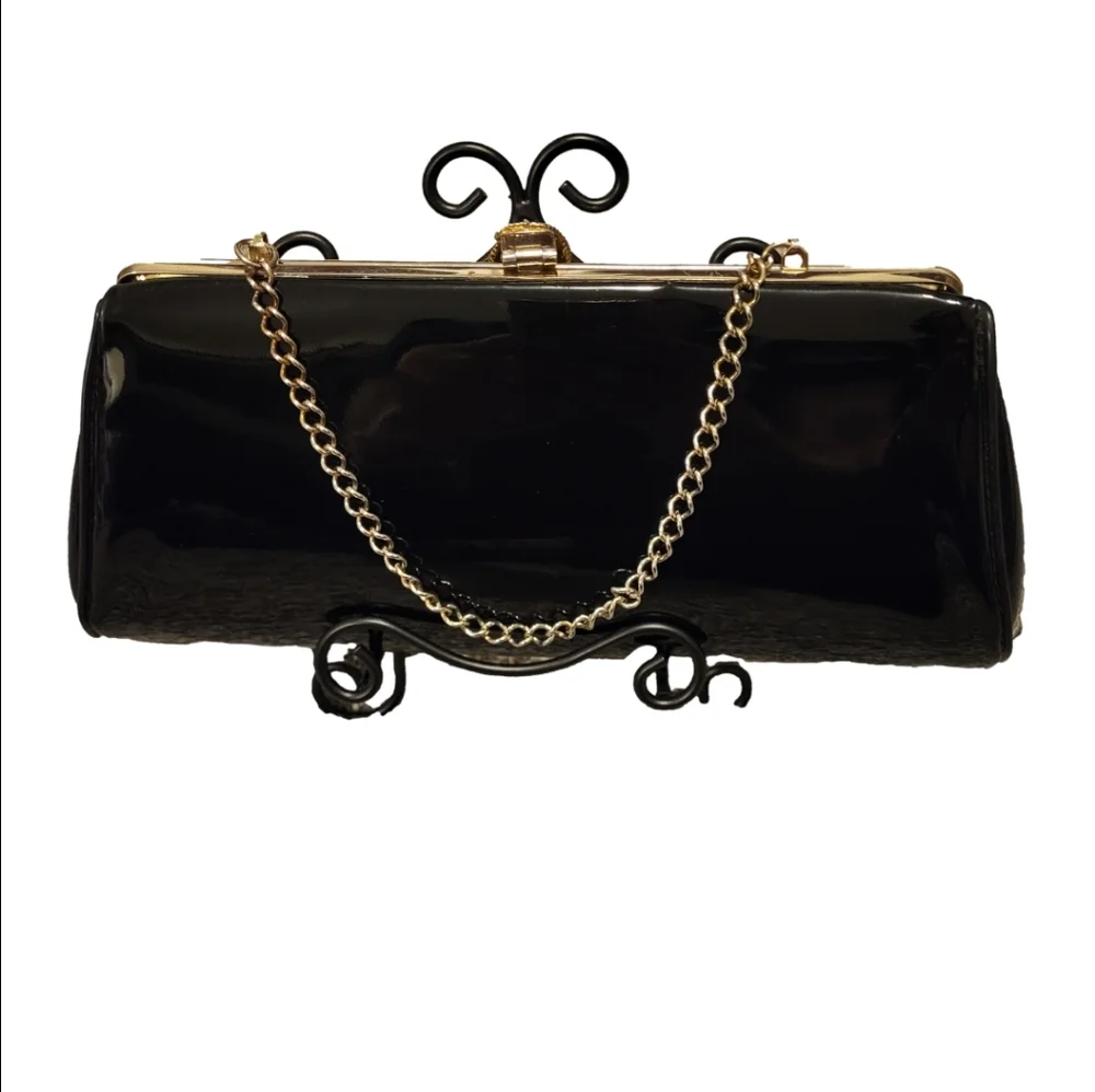 Elegant Black Clutch Bag with gold-tone hinged clasp and gold chain